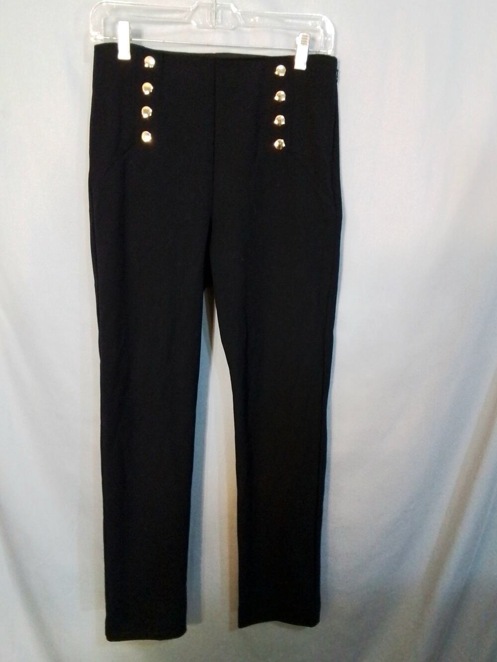 Ann Taylor black slacks with sailor buttons.